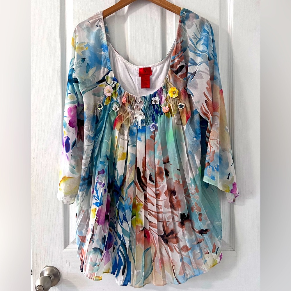 V Christina blouse with elastic. Has tank/camisole underneath. Thread pulled at